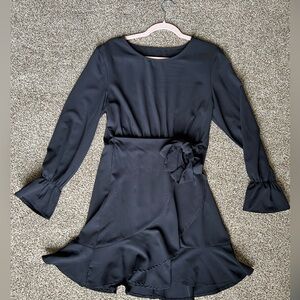 Little black dress with faux wrap and ruffle hem